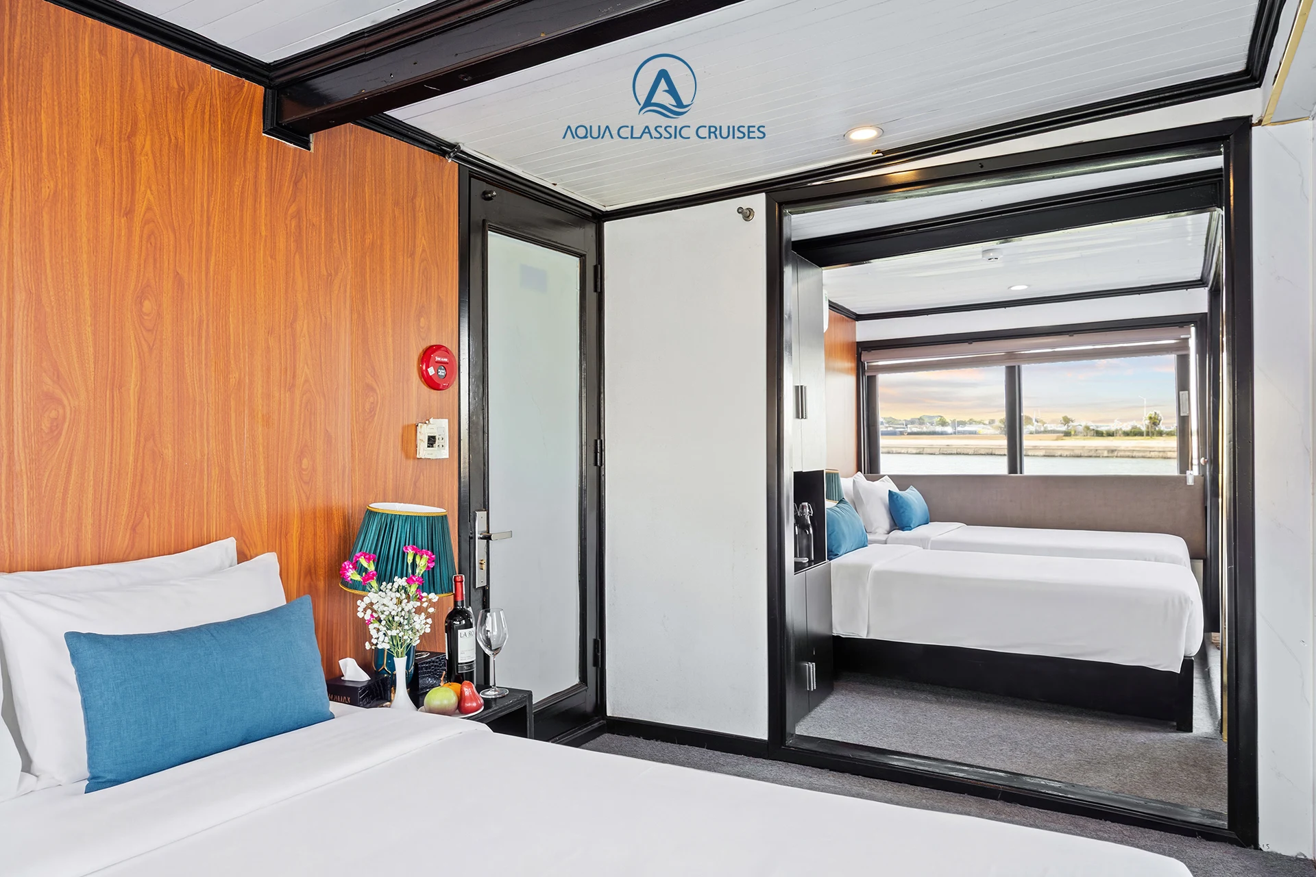 Family Suite Cabin double bedroom with a view into the twin bedroom on Aqua Classic Cruise