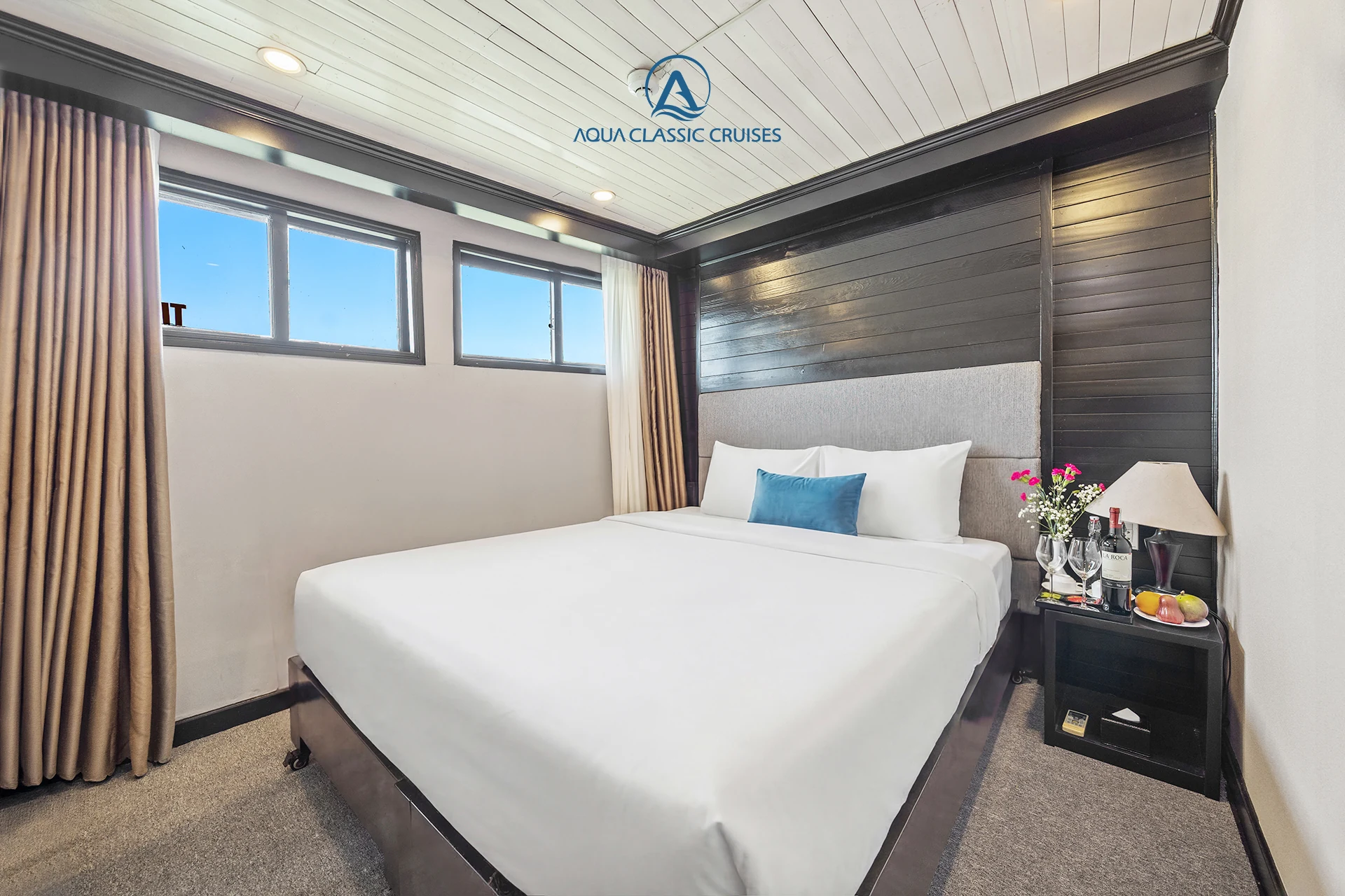 Standard seaview cabin with a double bed on Aqua Classic Cruise