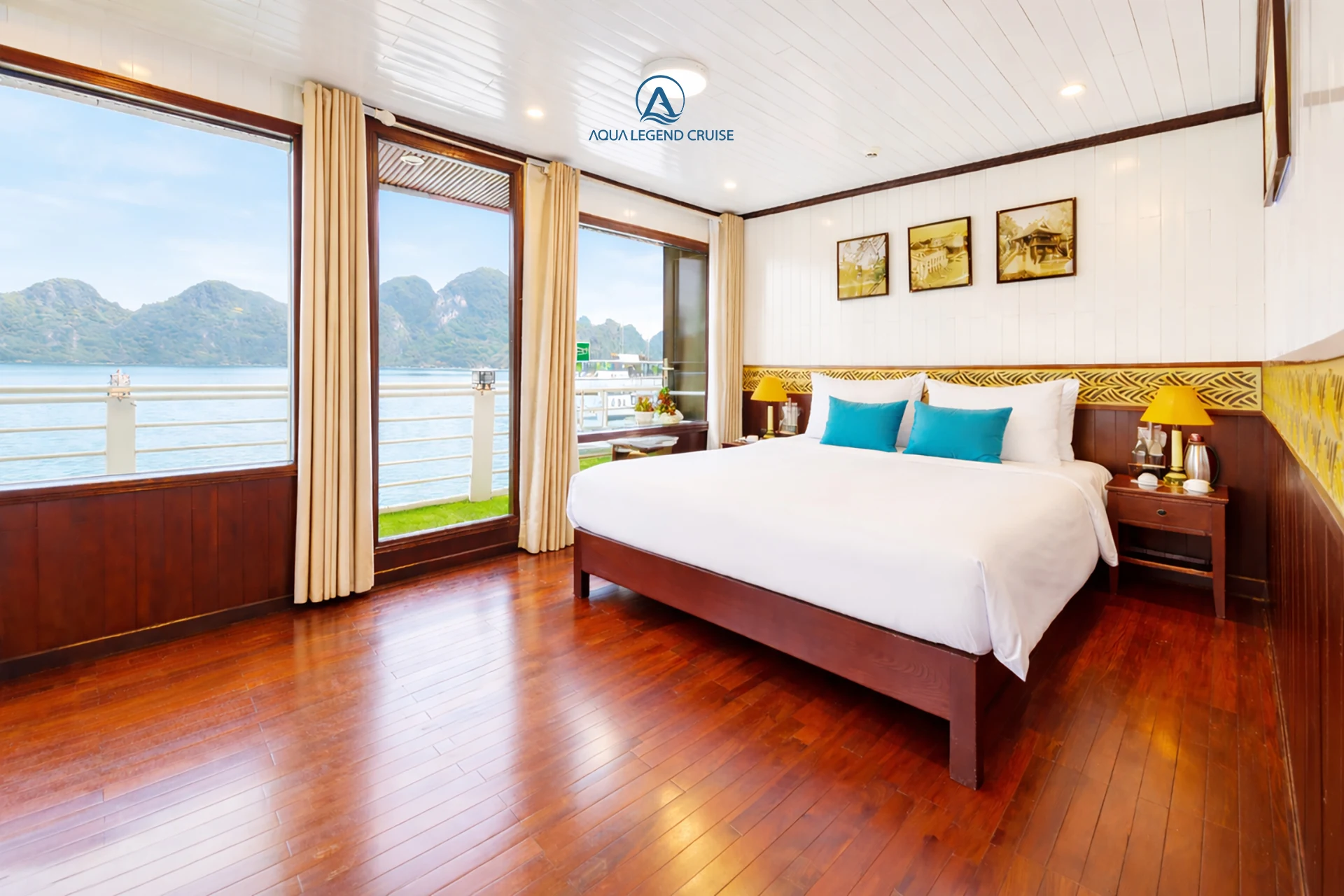 President Suite Balcony cabin with a double bed and floor-to-ceiling windows on Aqua Legend Cruise