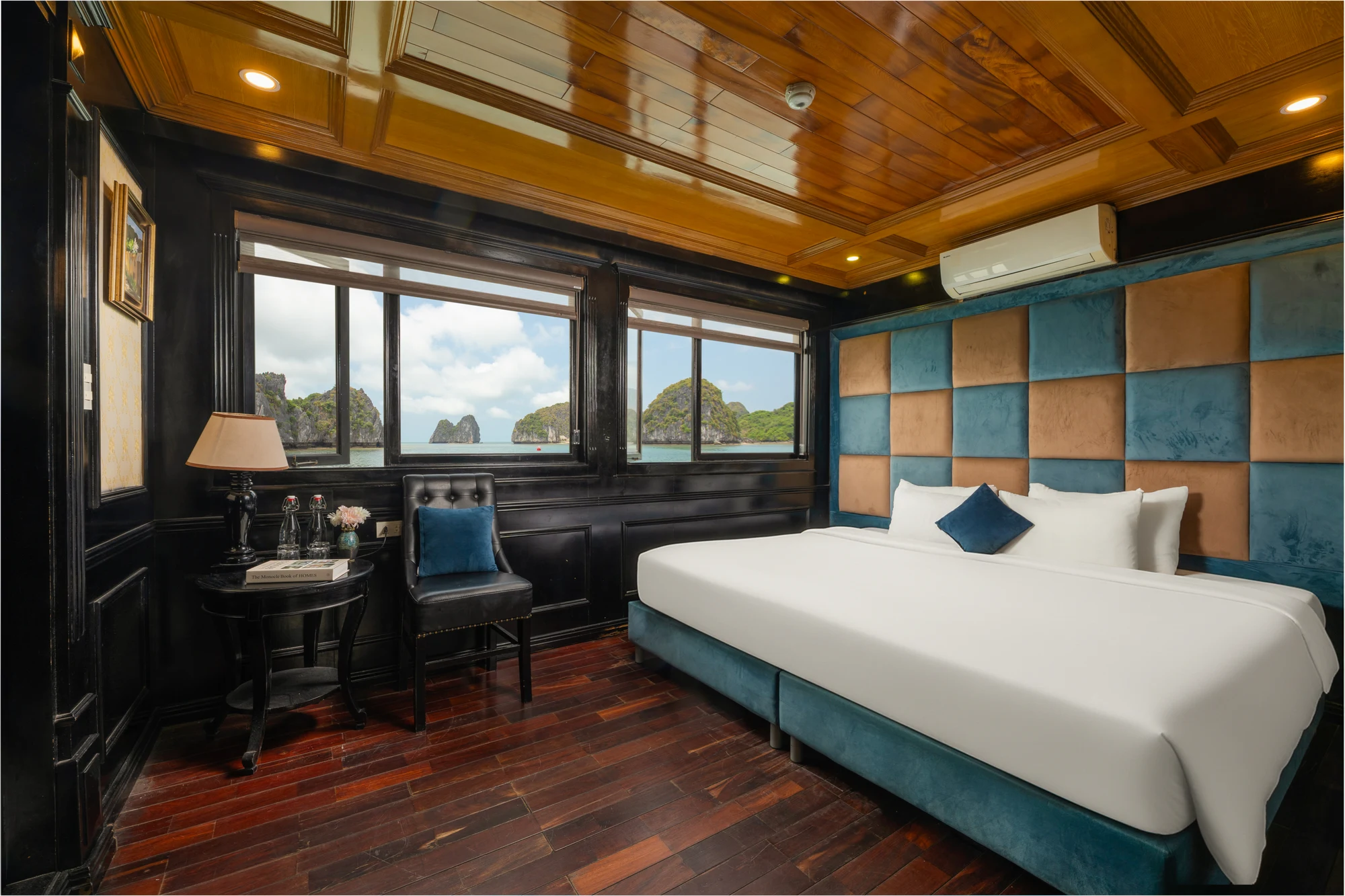 Deluxe Double Ocean View cabin with a double bed and bay-view windows on Quiet Bay Cruise